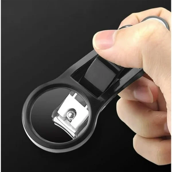 Nail clipper with magnifying glass